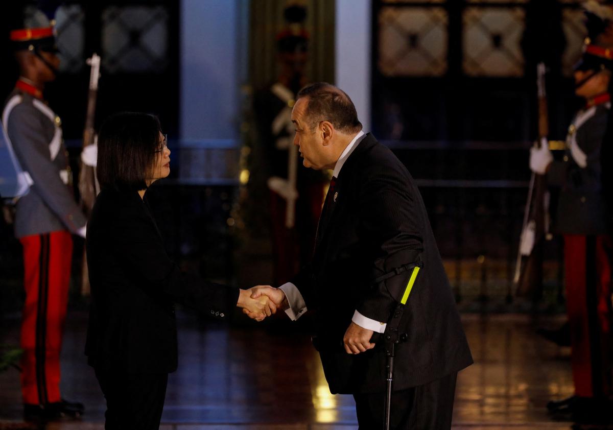 Taiwan President Tsai Ing-wen shakes hands with her Guatemalan counterpart Alejandro Giammatte in Guatemala City, Guatemala on March 31, 2023. 