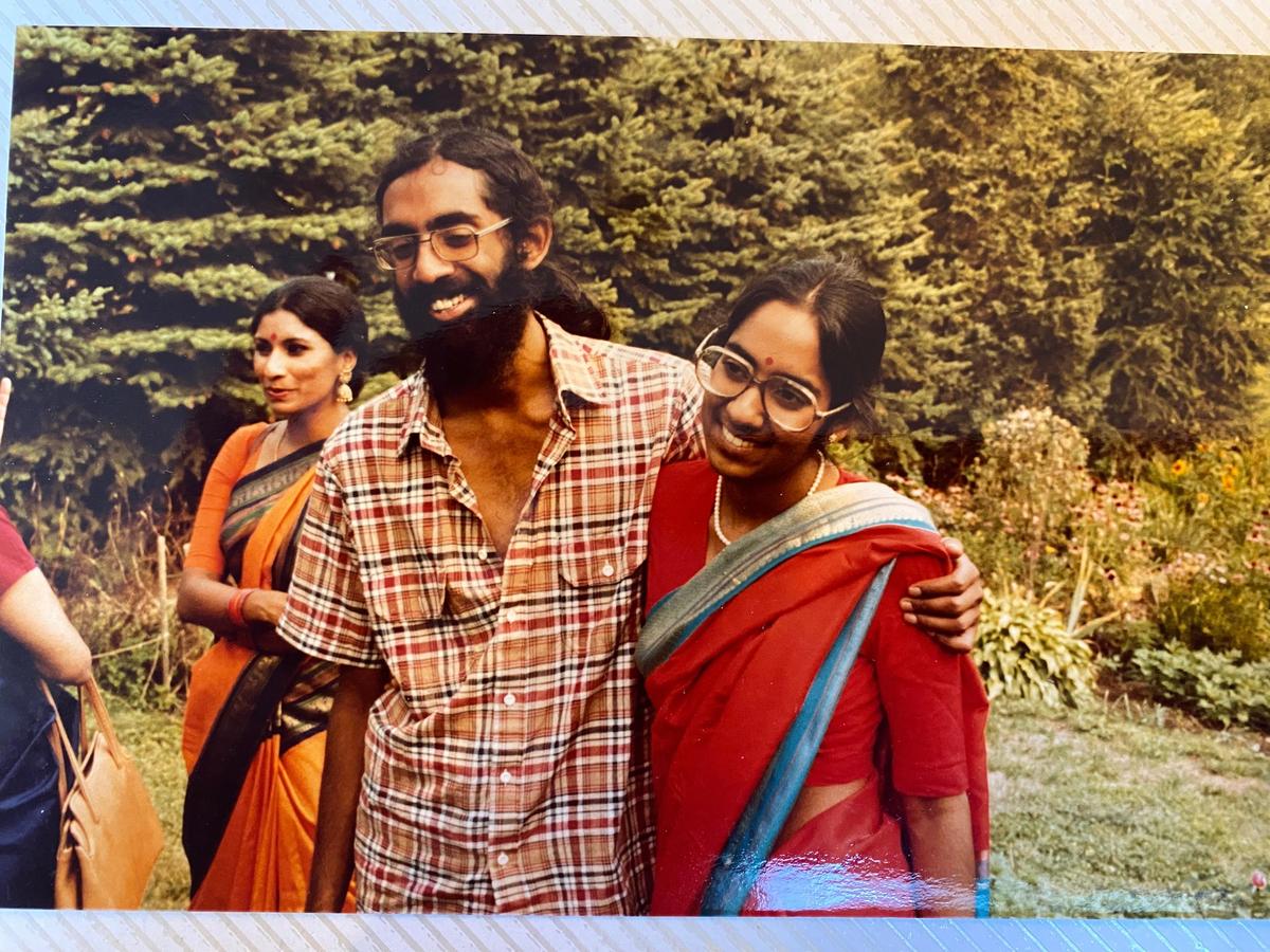 Tejaswini Rao chats with party guests while Subramanyam and Saraswathi Vedam embrace during their parents' wedding anniversary party at State College, Pa., in August 1981. Tejaswini Rao chats with party guests while Subramanyam and Saraswathi Vedam embrace during their parents' wedding anniversary party at State College, Pa., in August 1981.