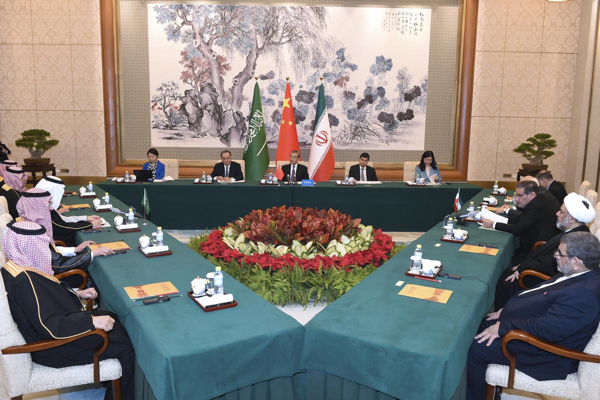 In this photo released by Xinhua News Agency, Wang Yi, China’s most senior diplomat presides over a closed meeting between Iran, led by Ali Shamkhani, the secretary of Iran’s Supreme National Security Council and Saudi Arabia, led by Saudi national security adviser Musaad bin Mohammed al-Aiban in Beijing, Saturday, March 11, 2023.
