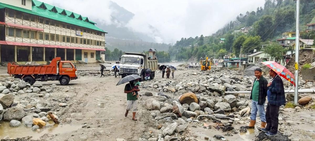 People look at the debris scattered around at a disaster-hit area, in Kullu, Sunday, August 31, 2025. People look at the debris scattered around at a disaster-hit area, in Kullu, Sunday, August 31, 2025.