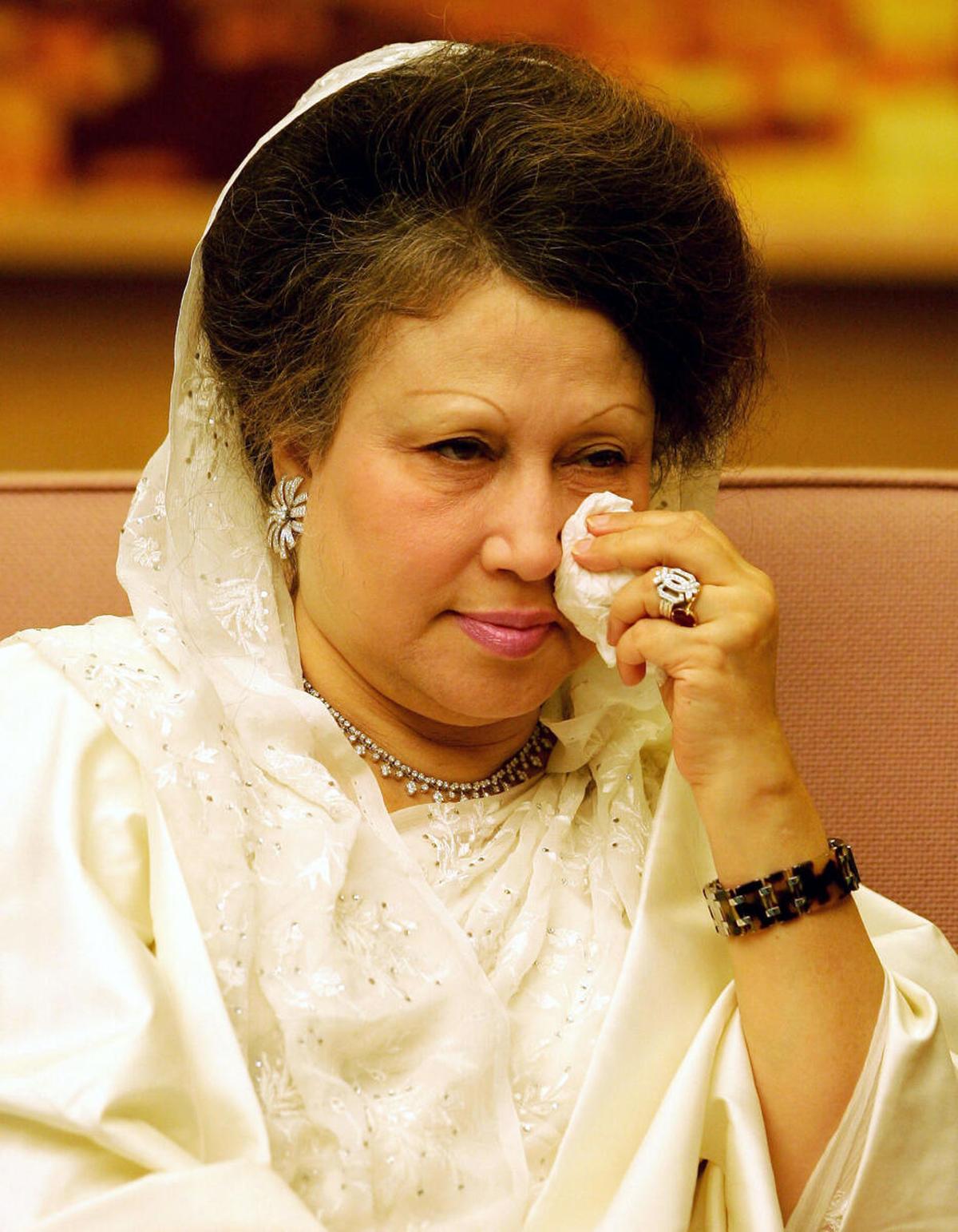 Prime Minister of Bangladesh, Khaleda Zia wipes her eyes during a meeting with Chinese Vice Premier Huang Ju at the Great Hall of the People in Beijing, 17 August 2005. Zia arrived in Beijing just hours after her homeland was rocked by more than 100 small bombs.