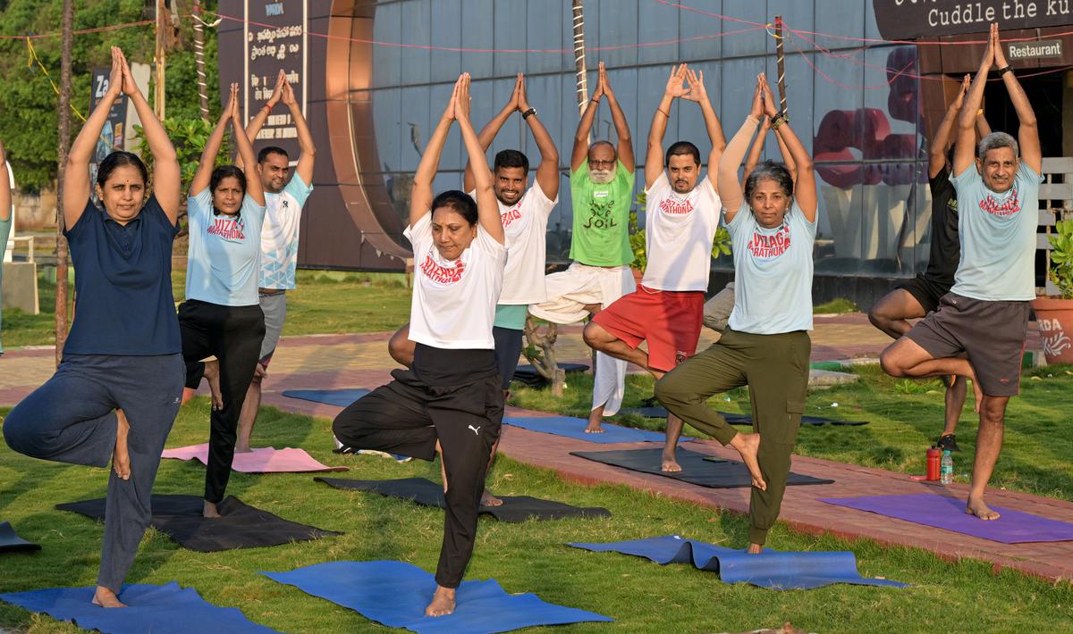 Members of Vizag Runners group participating in strength training session on the Beach Road  in Visakhapatnam.