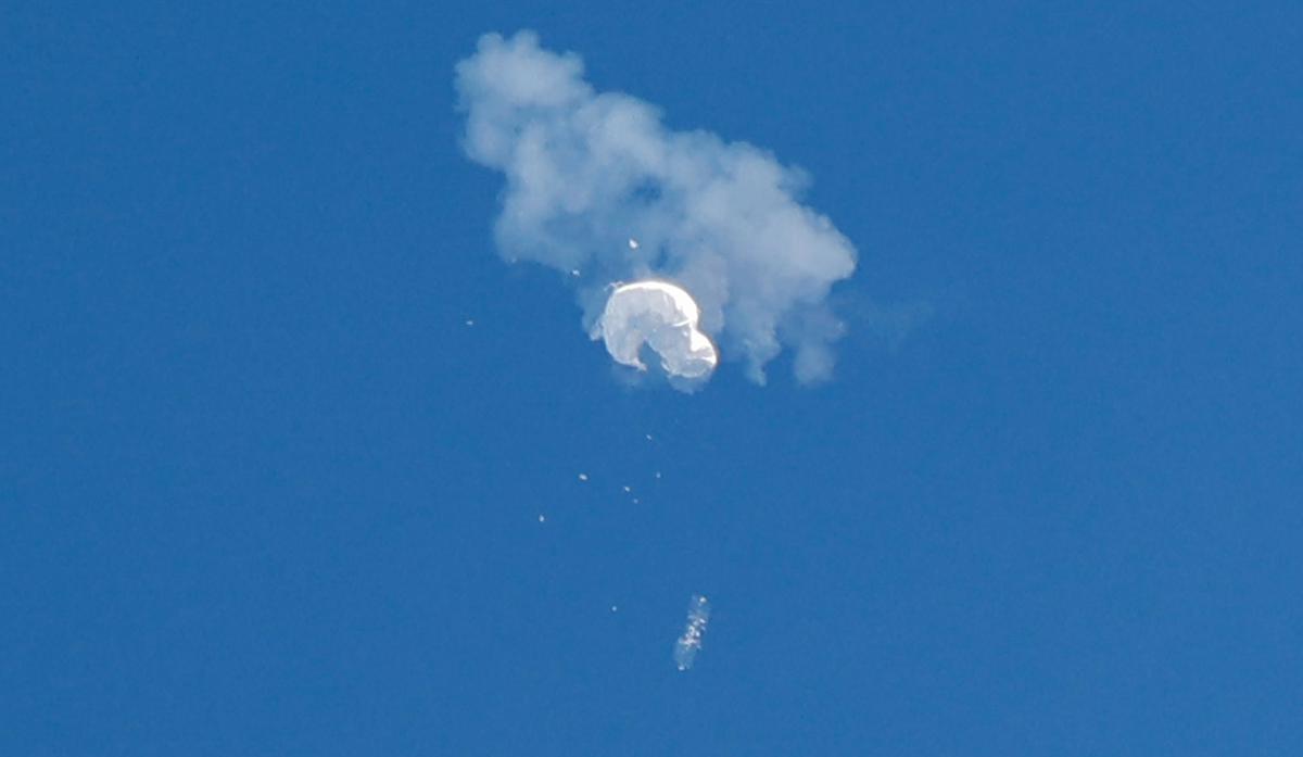 The suspected Chinese spy balloon drifts to the ocean after being shot down off the coast in Surfside Beach, South Carolina, U.S. February 4, 2023.  