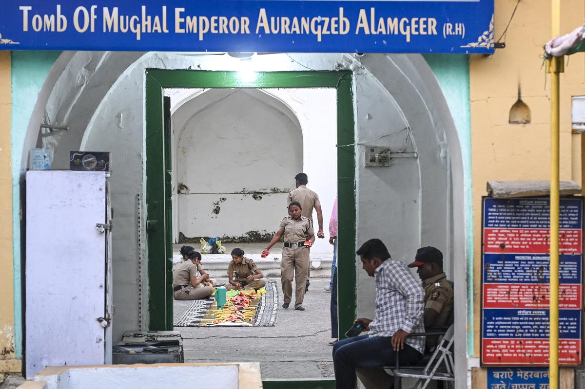 Police personnel prepare for iftaar inside the dargah complex in Khuldabad in Chhatrapati Sambhaji Nagar.