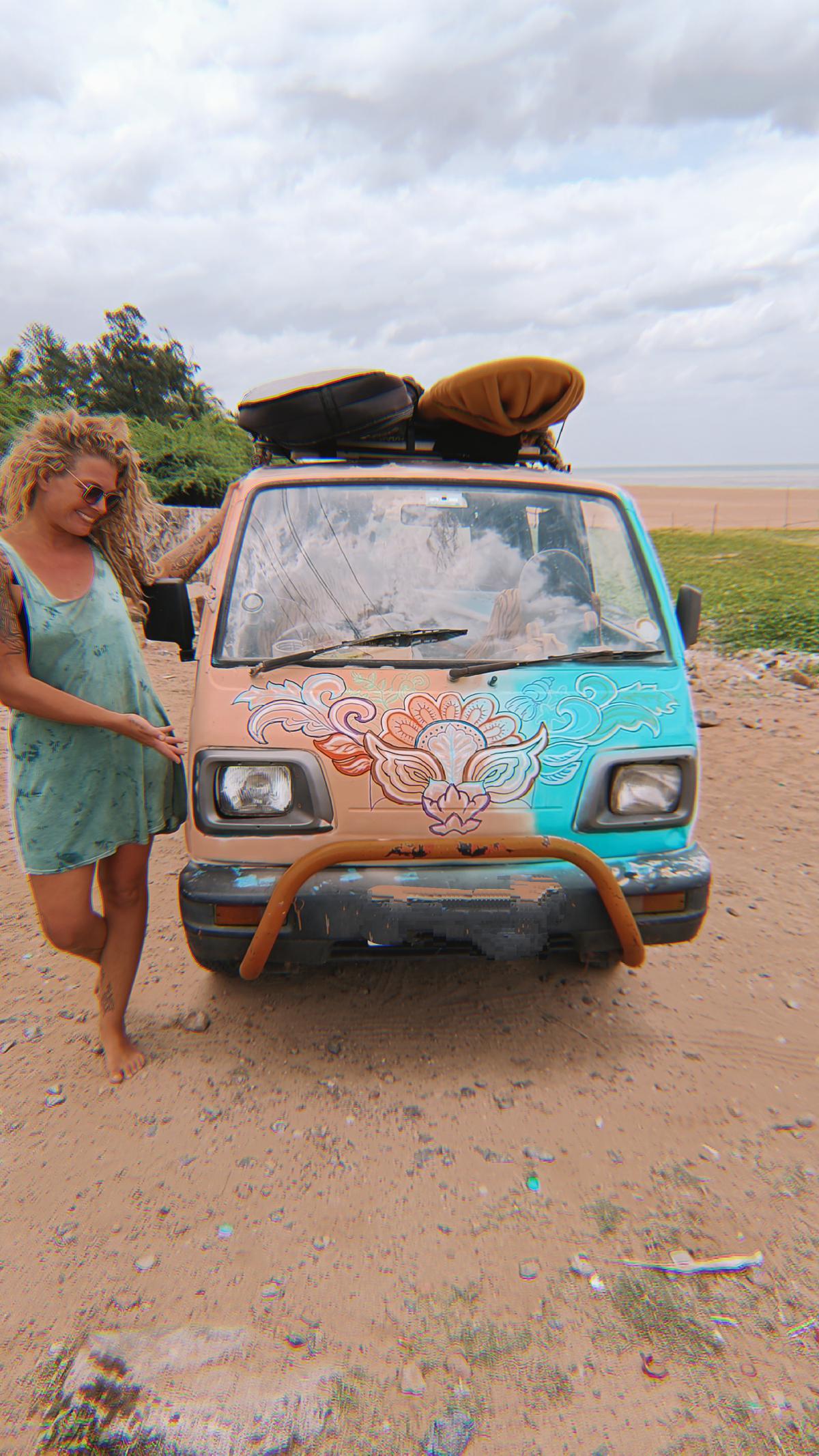 Surfboards and skateboards are stacked on the roof of the van