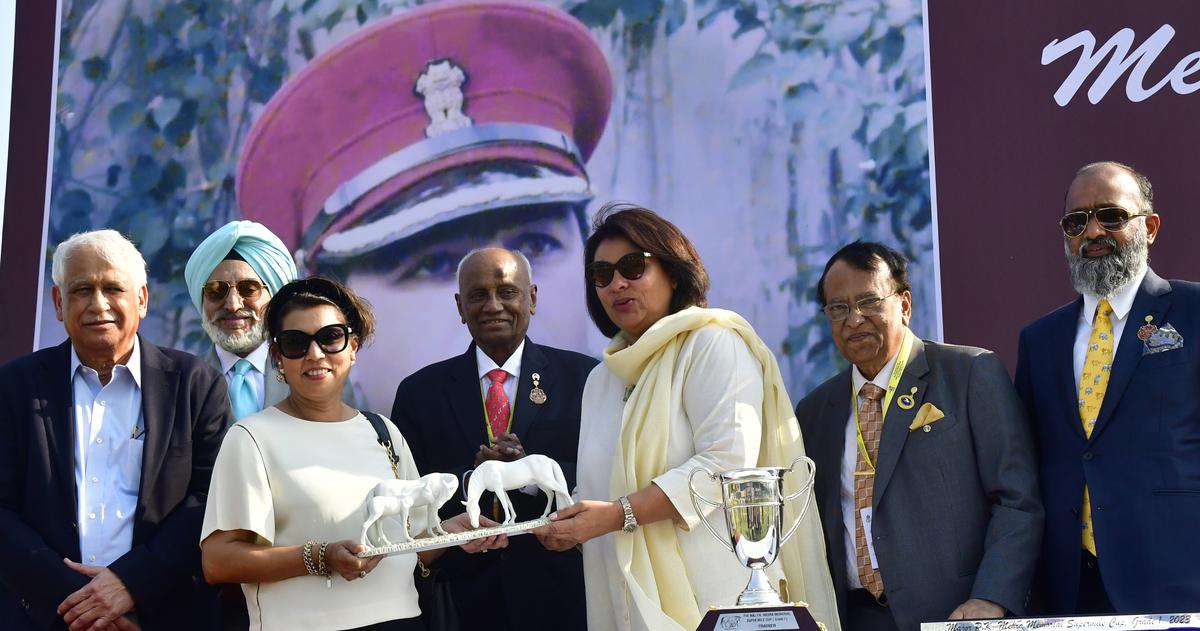 Ameeta Mehra presenting the Maj. P. K. Mehra Memorial Super Mile Cup to Mrs. Vijay B. Shirke, the owner of Northern Lights, in the presence of M.A.M.R. Muthiah, chairman, Madras Race Club, Turf Authorities of India and BTC chairman Shivkumar Kheny, second from right and Surender Reddy, chairman, Hyderabad Race Club, centre, at the Bangalore Turf Club in Bengaluru on March 05, 2023. 