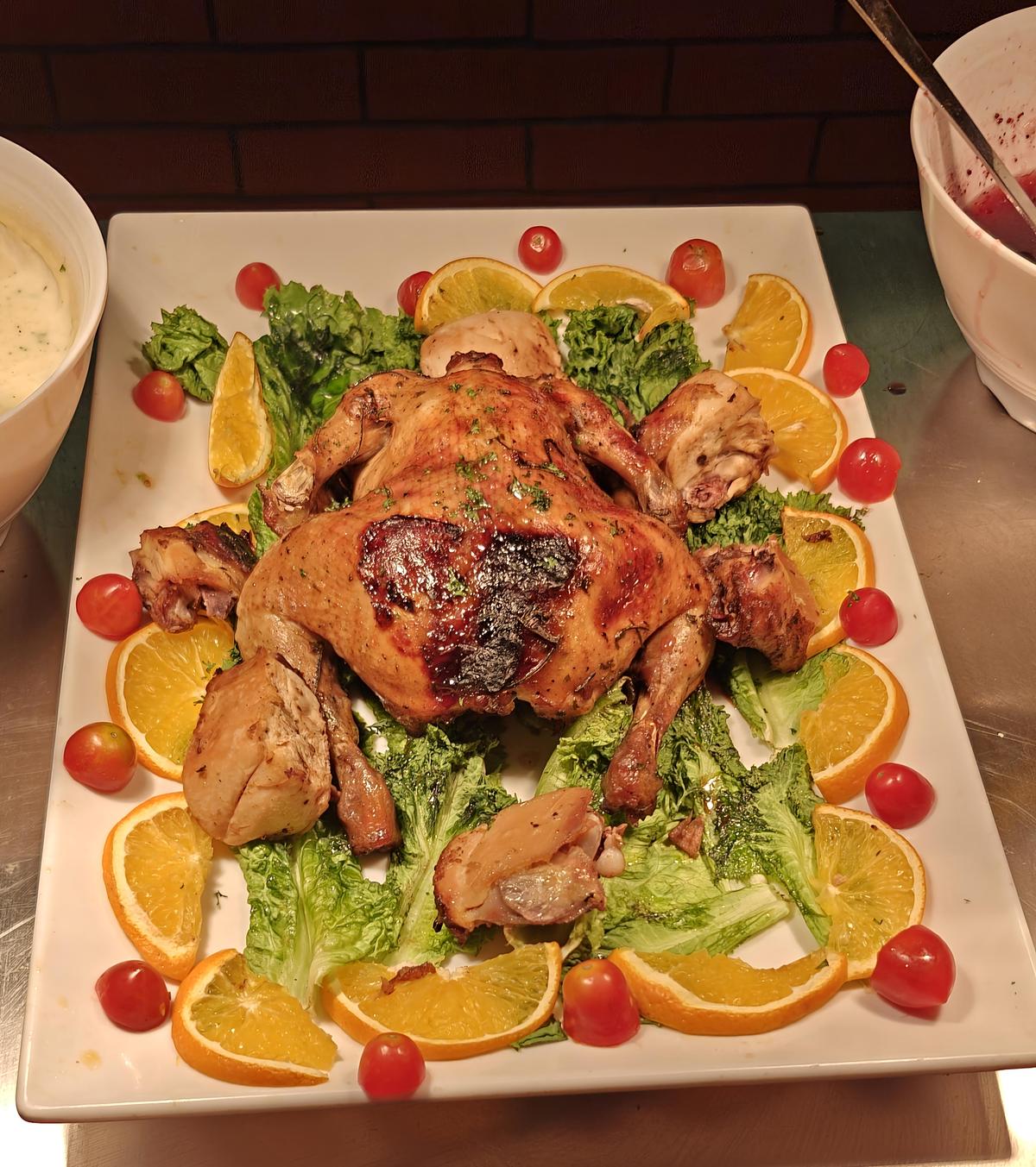 A live counter doling out roasted chicken with cranberry sauce 