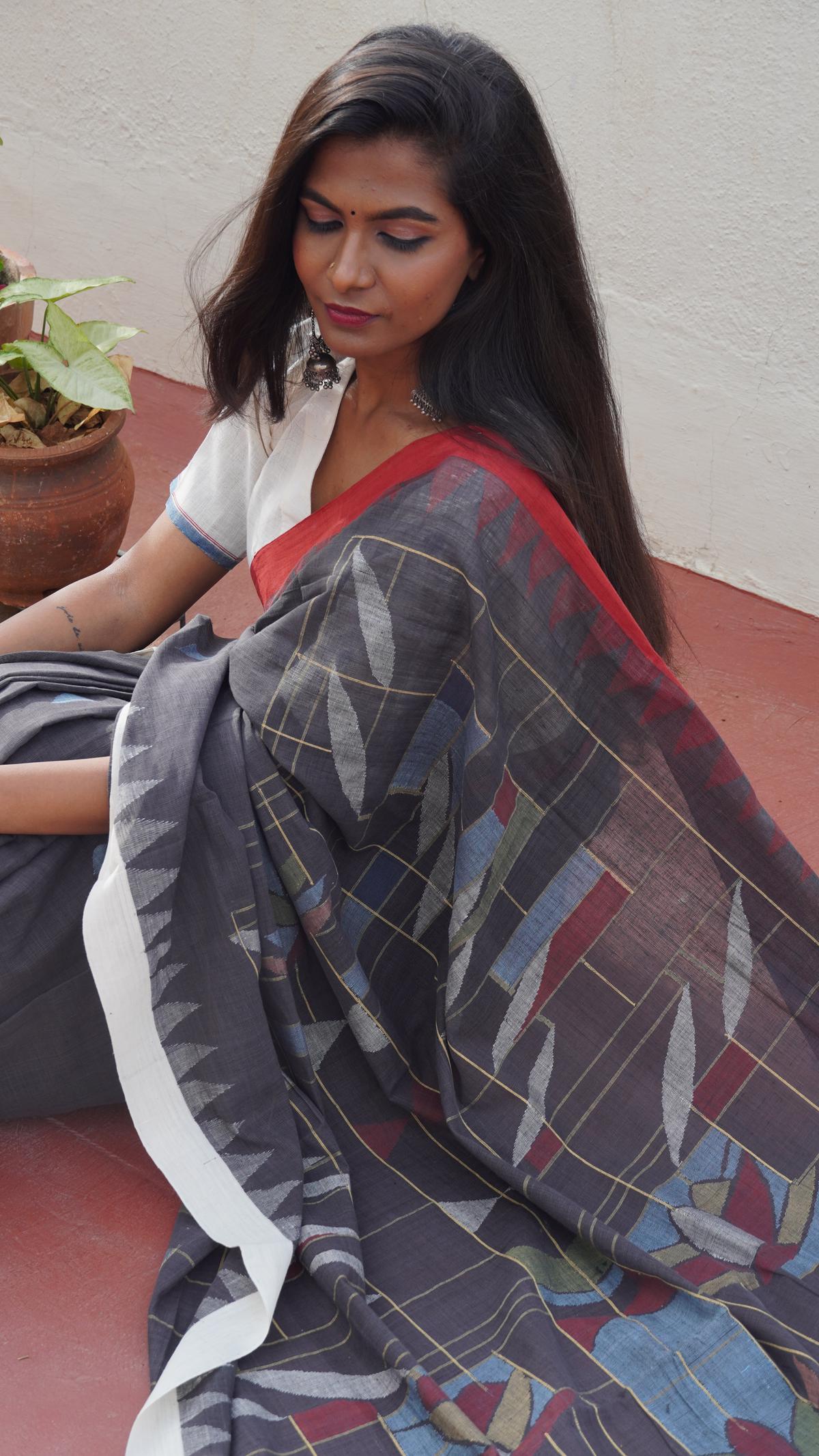 A model in a jamdani saree