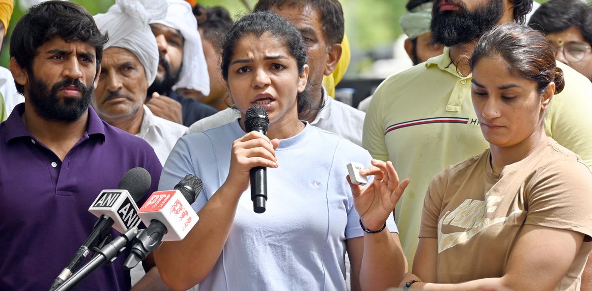 File photo of wrestlers Vinesh Phogat, Sakshi Malik, and Bajrang Punia during their protest against Wrestling Federation of India (WFI) chief Brij Bhushan Sharan Singh, at Jantar Mantar, on May 28, 2023 in New Delhi. File photo of wrestlers Vinesh Phogat, Sakshi Malik, and Bajrang Punia during their protest against Wrestling Federation of India (WFI) chief Brij Bhushan Sharan Singh, at Jantar Mantar, on May 28, 2023 in New Delhi.