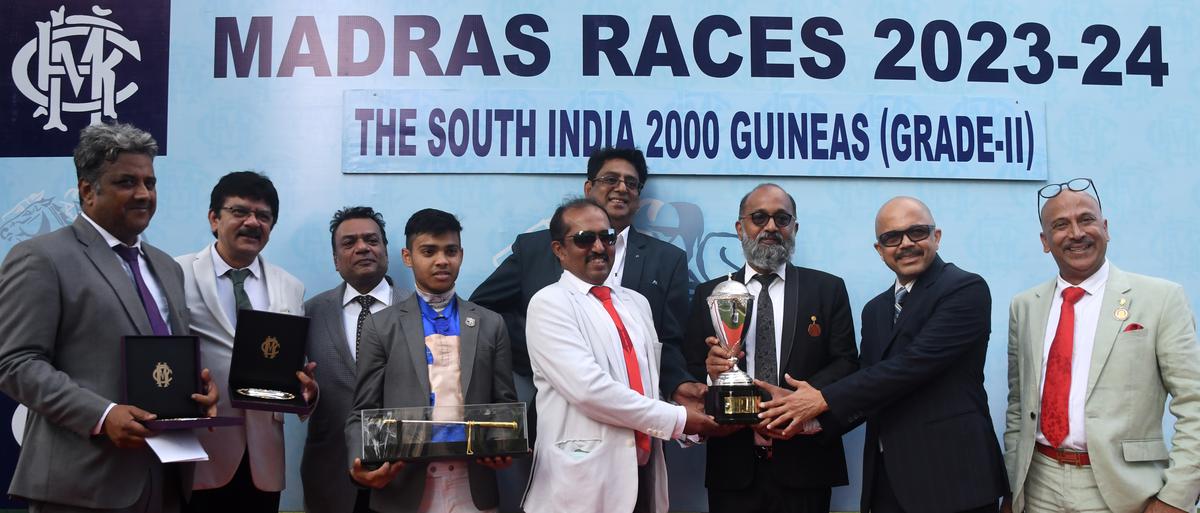 A day to cherish: Trainer Prasanna Kumar, Dharmesh Mehta, Srikanth Badruka, jockey G. Vivek, K. Kamesh, M.N. Nambiar, K. Bala Mukunda Das and Sanjeev Basapa with the South India 2000 Guineas Trophy from Madras Race Club chairman M.A.M.R. Muthiah, third from right, after Knotty Charmer took the honours.