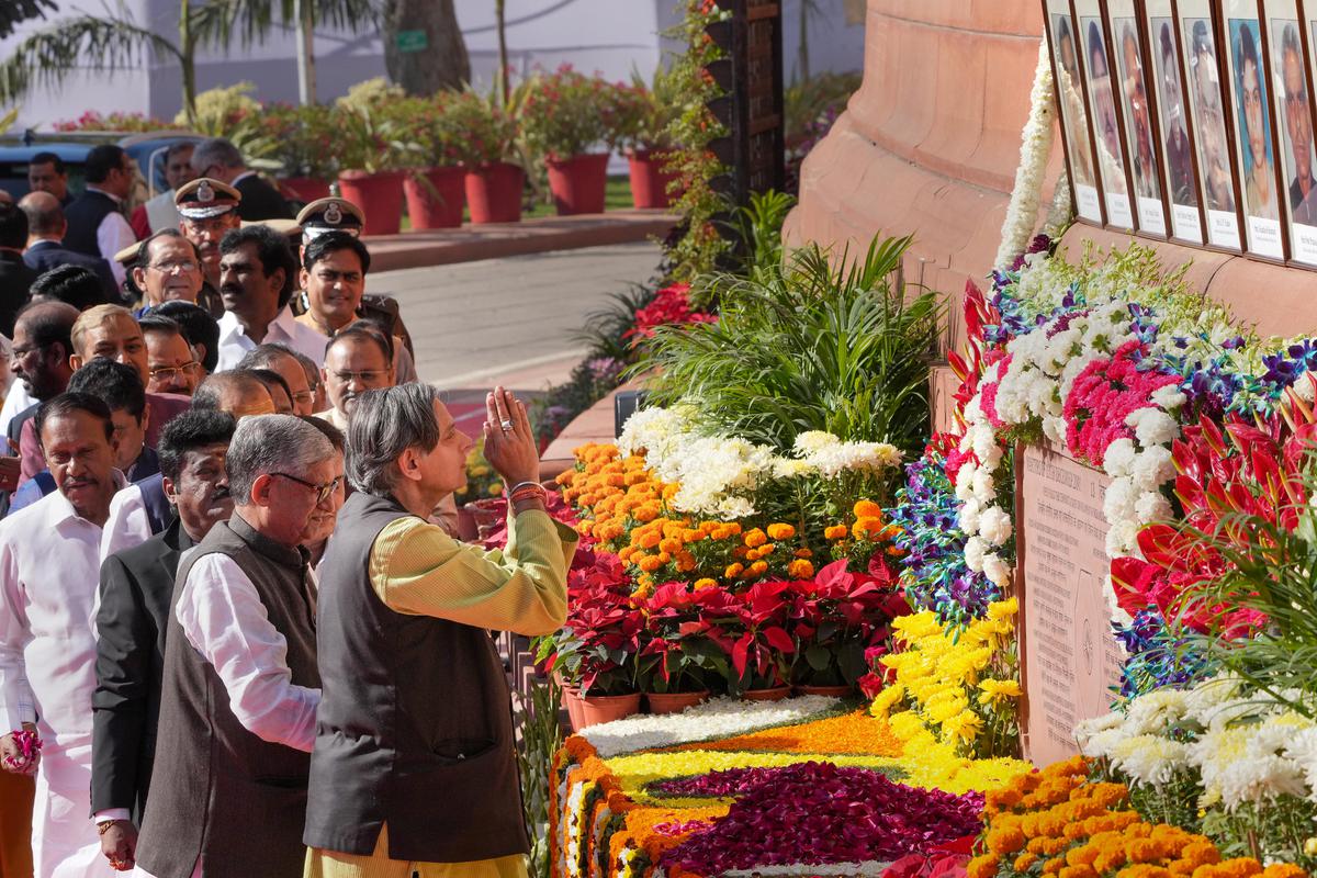 Congress MP Shashi Tharoor pays homage to martyrs who lost their lives in the 2001 Parliament attack on its 21st anniversary, at Parliament House complex in New Delhi, on Dec. 13, 2022. 