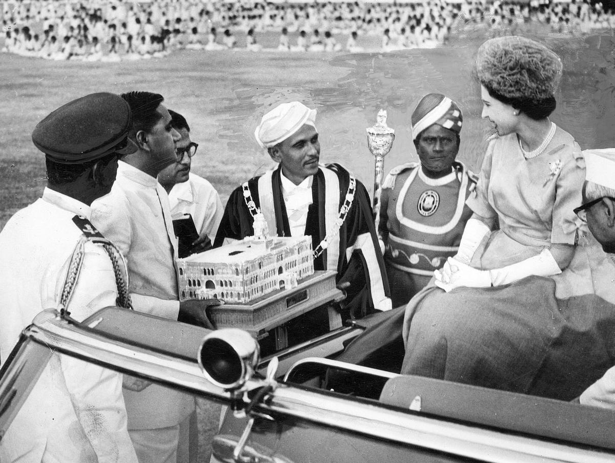 A replica of the Rippon Buildings, the headquarters of the then Madras Corporation in silver, being presented to Queen Elizabeth II at a children’s rally at the stadium in Madras on February 21, 1961.