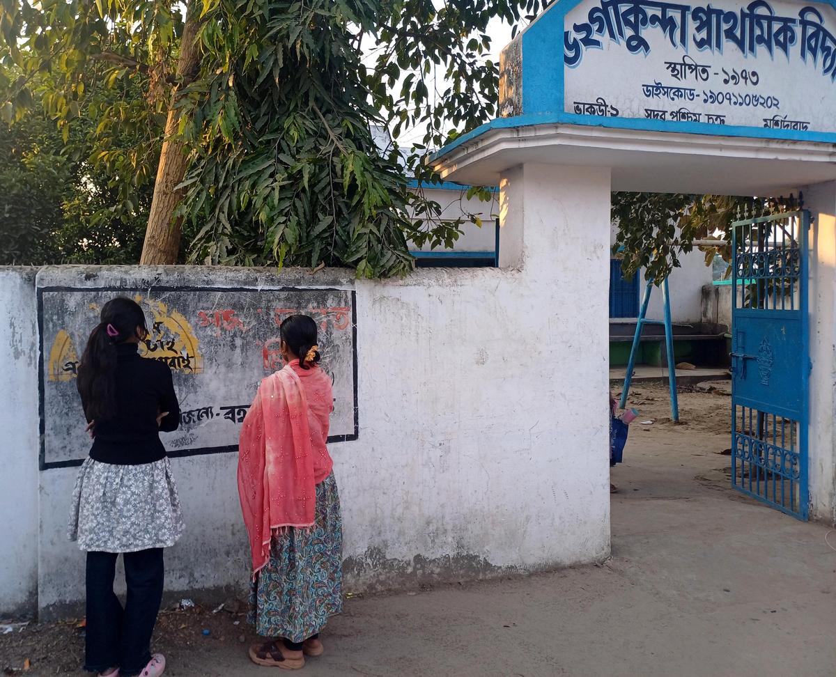 Two girls who have been honoured as Kanyashree Warriors by the Murshidabad District Administration outside Gakunda Primary School at Bhakuri 2-gram panchayat in Behrampore block of Murshidabad district. The gram panchayat has been declared Child Marriage Free by the District authorities with no child marriage recorded in the past six months. 