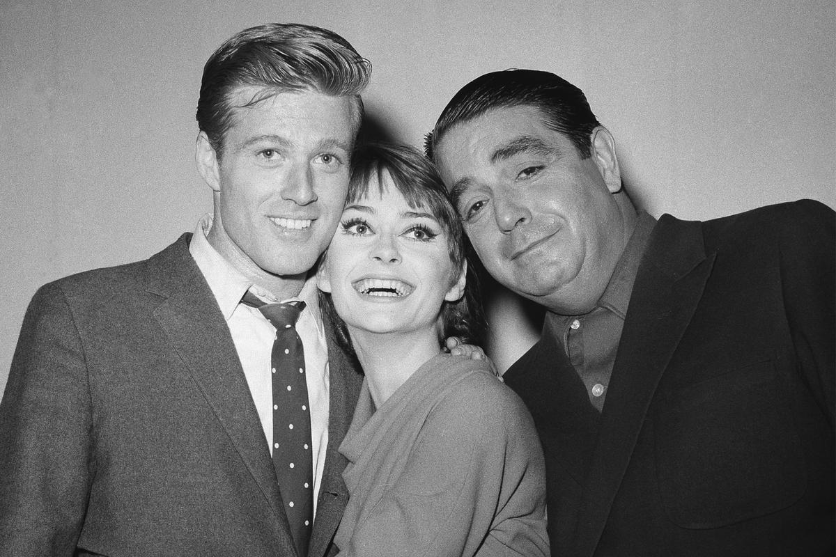 (Left) Robert Redford, Elizabeth Ashley, and Kurt Kaznar appear backstage on opening night of their comedy play ‘Barefoot in the Park’, directed by Mike Nichols, in New York on October 23, 1963.