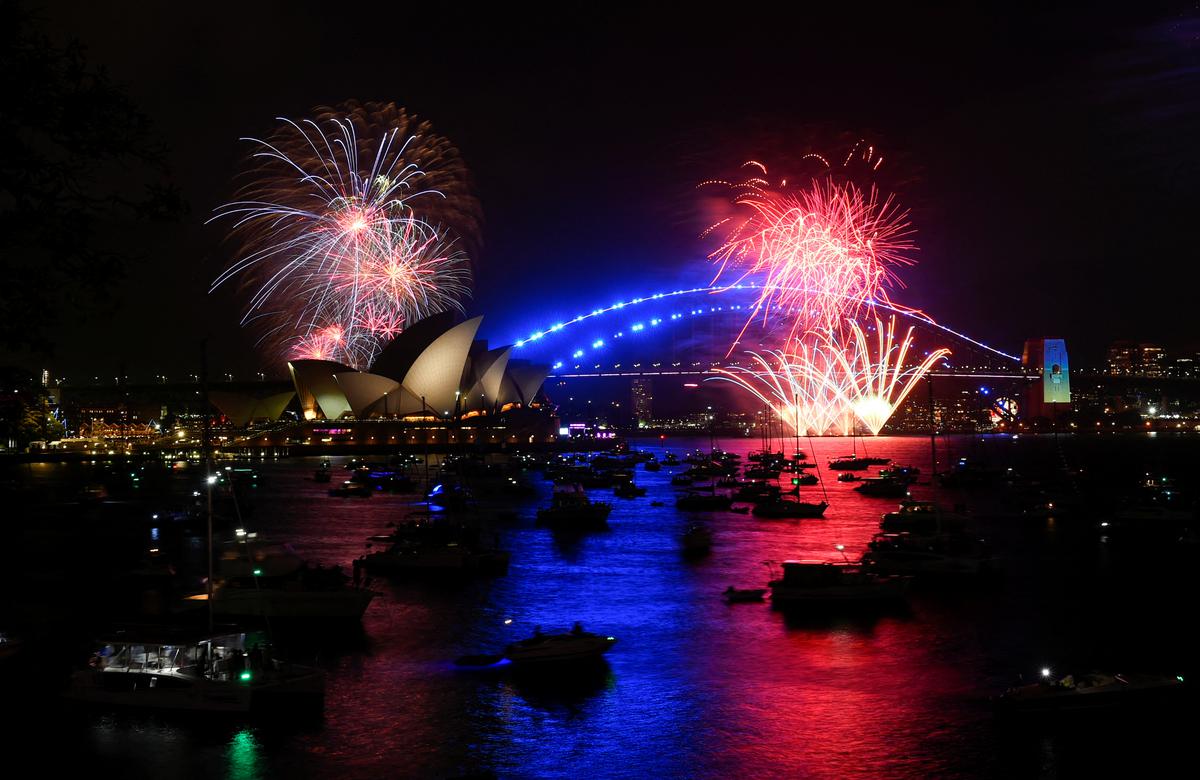 Early fireworks explode over Sydney Opera House during the New Year’s Eve celebrations, in Sydney, Australia, December 31, 2022. 