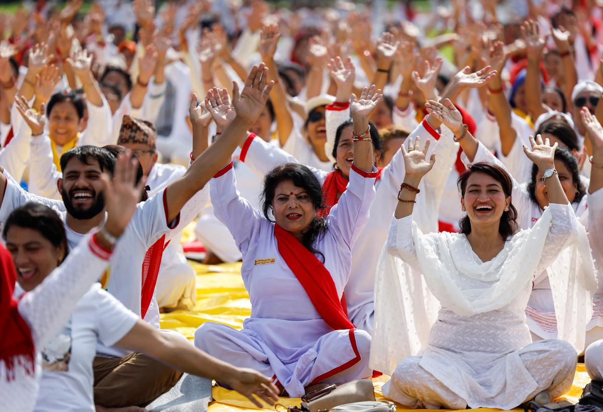 People perform yoga during an event organised to mark International Yoga Day in Kathmandu, Nepal on June 21, 2022.  