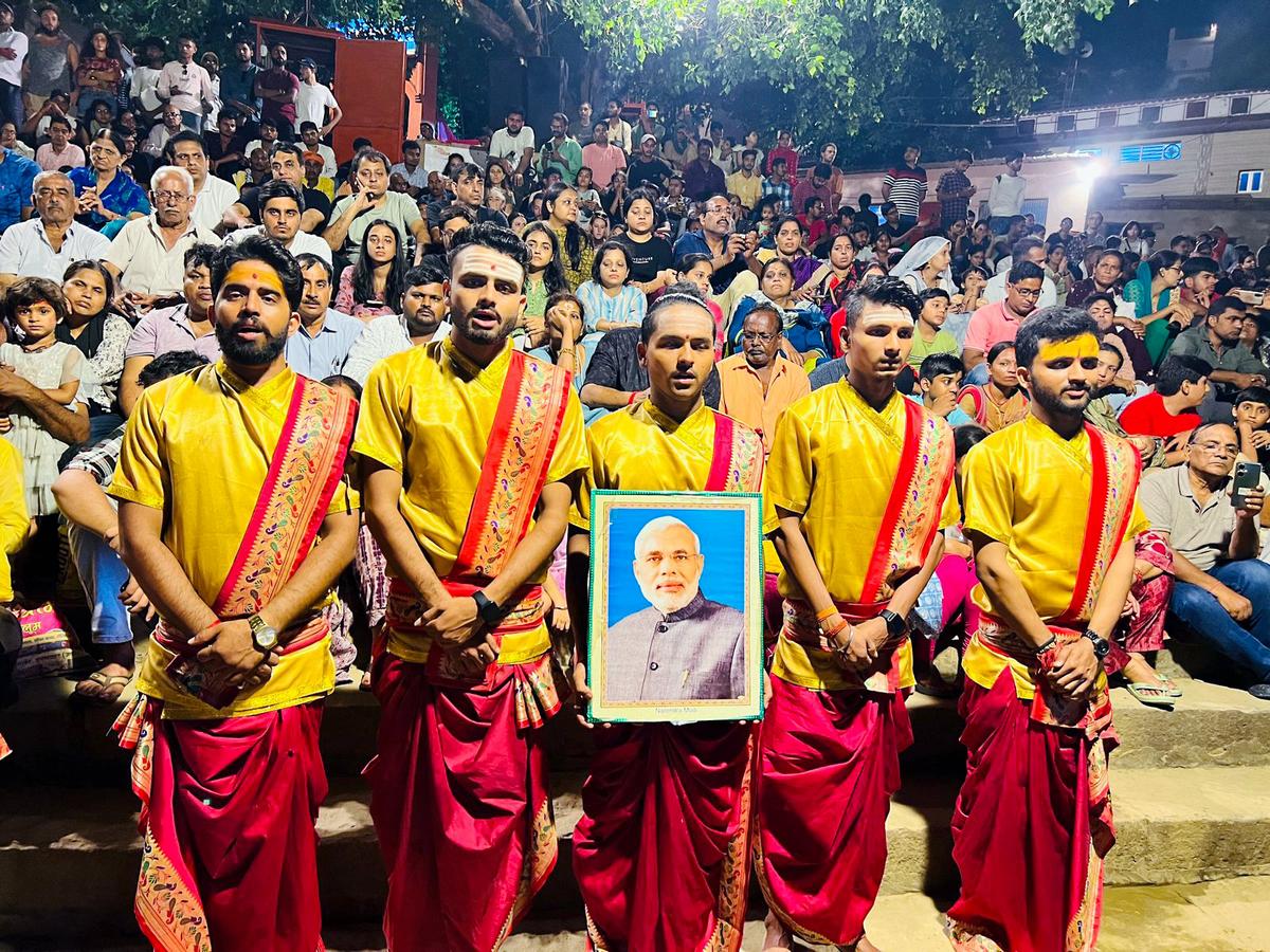 Priests and people celebrate by taking part in a Ganga Aarti for Prime Minister Narendra Modi’s 73rd birthday on its eve, in Varanasi on September 16.