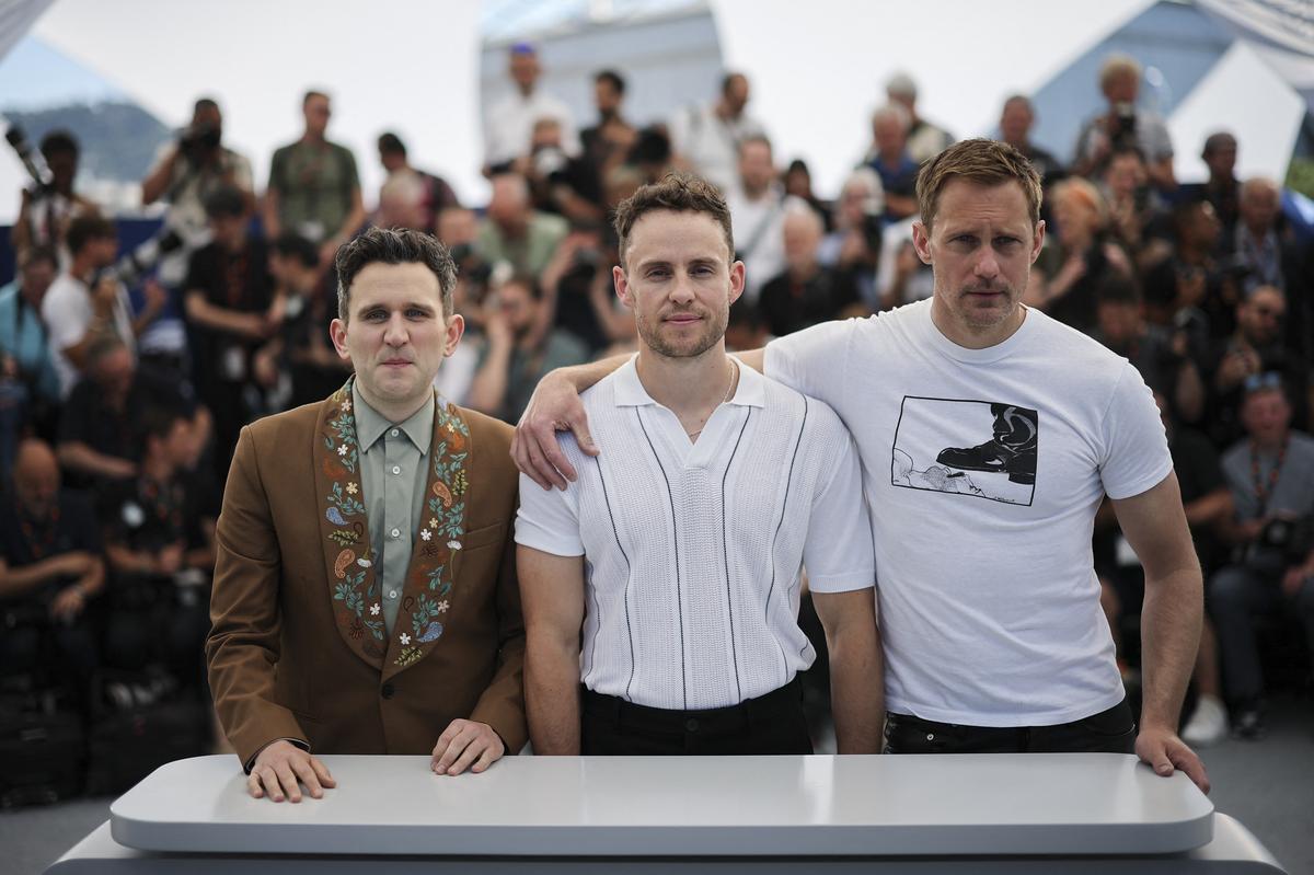 Writer and director Harry Lighten, Cast Member Alexander Scarsgard and Harry Mailing poses during a photocol for 'Pillion' at the 78th Cannes Film Festival