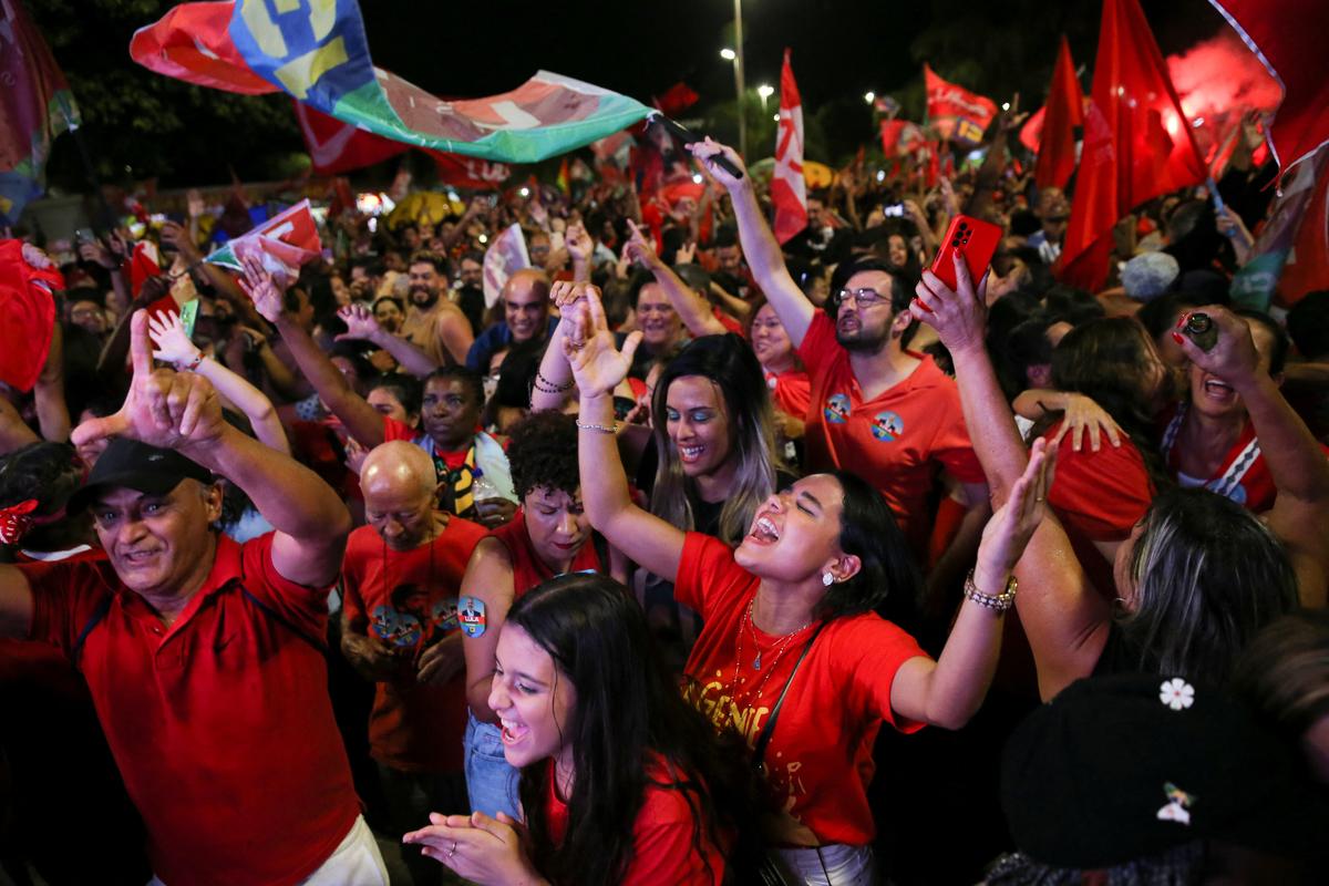 Supporters of Brazil’s former president and presidential candidate Luiz Inacio Lula da Silva react as they gather on the day of the Brazilian presidential election run-off, in Brasilia, Brazil on October 30, 2022. 