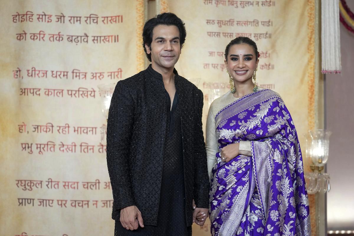 Indian actor Rajkummar Rao poses for a photograph with his wife Patralekha at the wedding reception of billionaire Mukesh Ambani’s son Anant Ambani and Radhika Merchant in Mumbai, India, Sunday, July 14, 2024