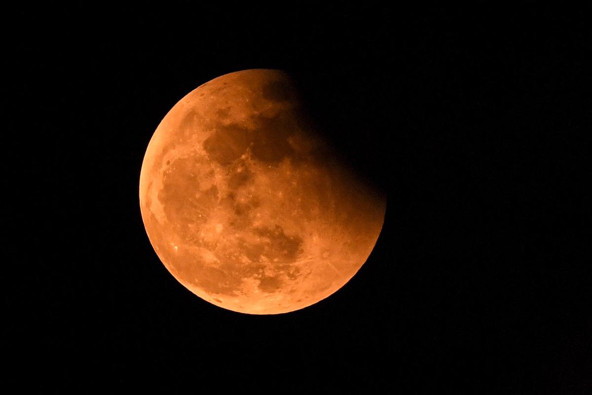 Lunar eclipse seen near the Beach Road in Visakhapatnam on Tuesday. Different parts of India and the world witnessed a total lunar eclipse on Tuesday, just a fortnight after a partial solar eclipse.