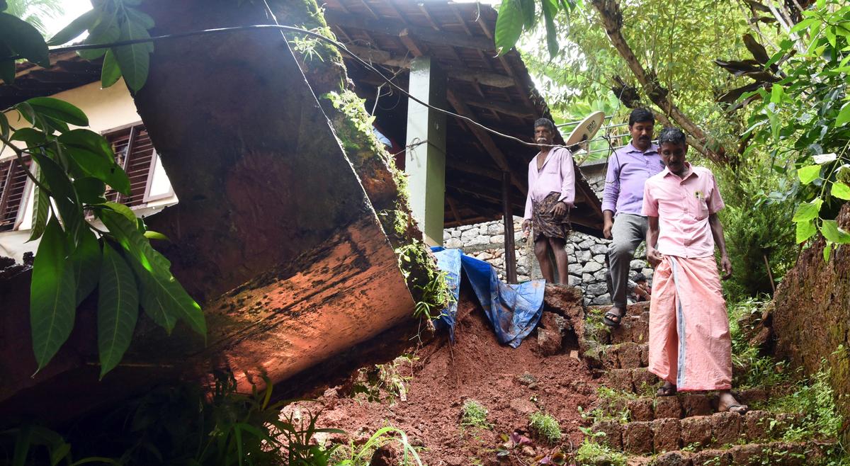 One of the houses that was damaged after a tall compound wall collapsed in the rain at Kottooli in Kozhikode on Tuesday.