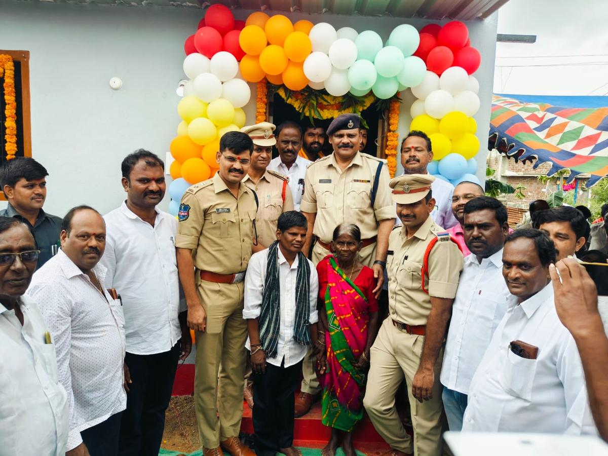 SP S.R. Kekan and others after inaugurating the house at Pedda Nagaram village on Sunday.