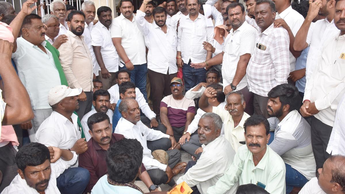 Hunsur MLA leads farmers’ protest outside MCDCC Bank 