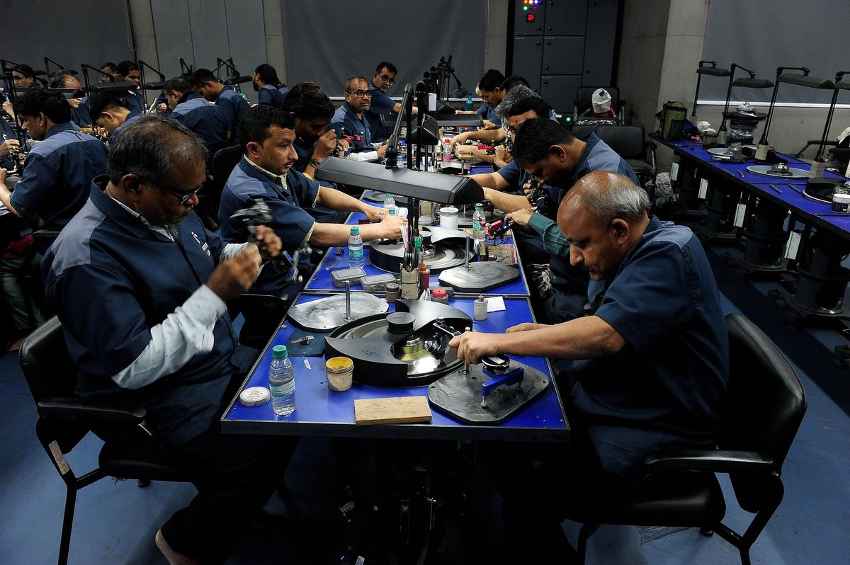 Diamond workers seen working at a lab-grown diamond factory in Surat.