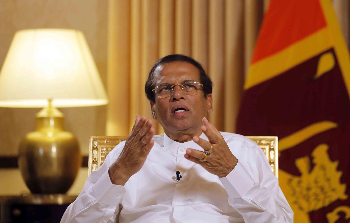 FILE- Sri Lankan President Maithripala Sirisena speaks during an interview with the Associated Press at his residence in Colombo, Sri Lanka, May 7, 2019.