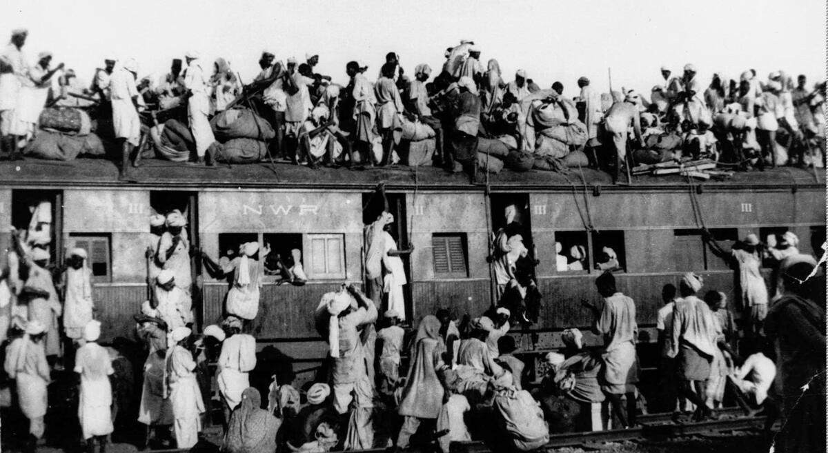 In this September 1947, file photo hundreds of Muslim refugees crowd on top a train leaving New Delhi for Pakistan. After Britain ended its colonial rule over the Indian subcontinent, two independent nations were created in its place _ the secular, Hindu-majority nation of India, and the Islamic republic of Pakistan. The division, widely referred to as Partition, sparked massive rioting that killed up to 1 million, while another 15 million fled their homes in one of the worlds largest ever human migrations.