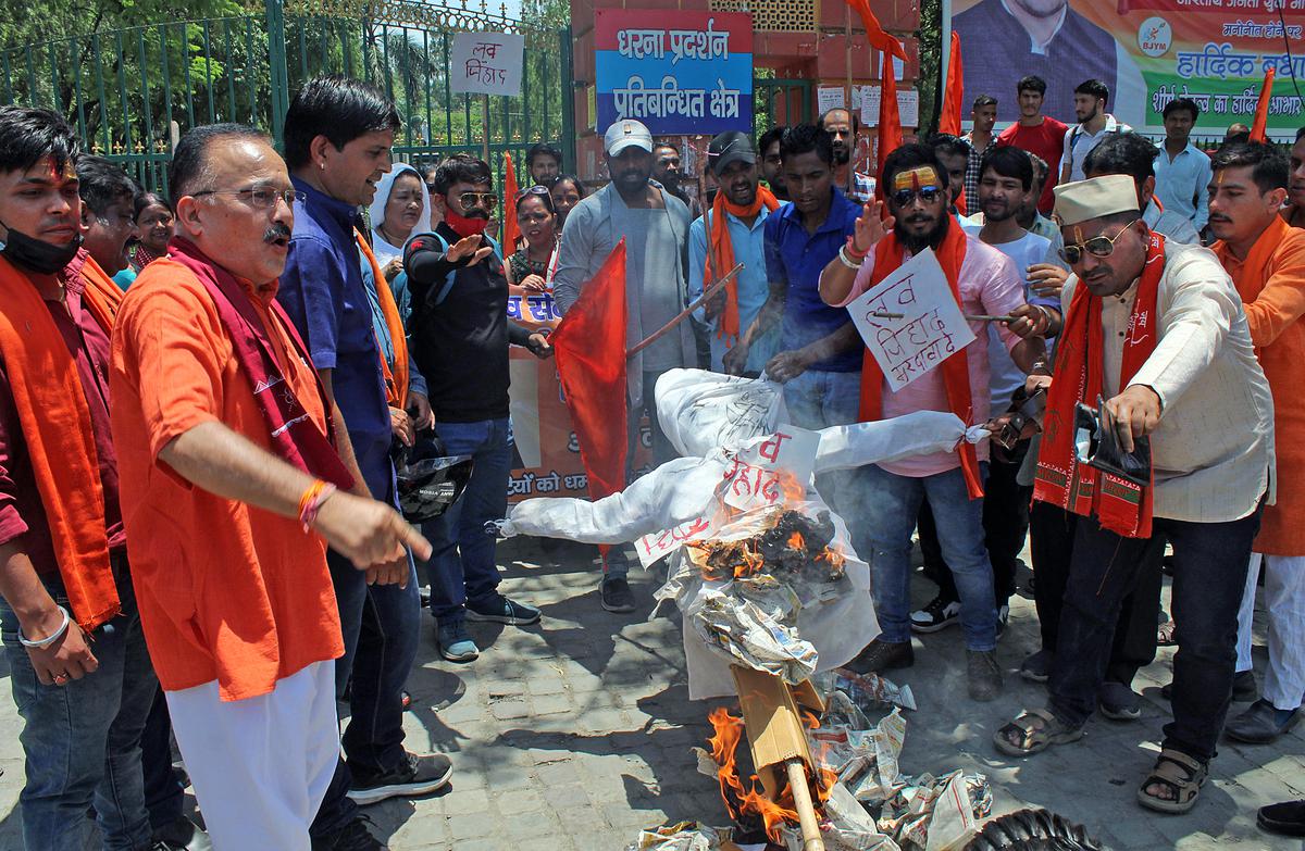 Members of Bhairav Sena Sangathan burn an effigy during a protest against the increasing cases of ‘love jihad’ in Uttarakhand, Dehradun.