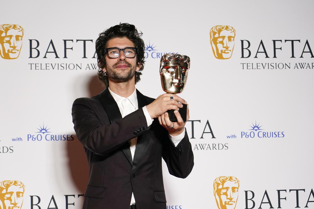Ben Whishaw poses with the Leading Actor award at the BAFTA Television Awards in London.
