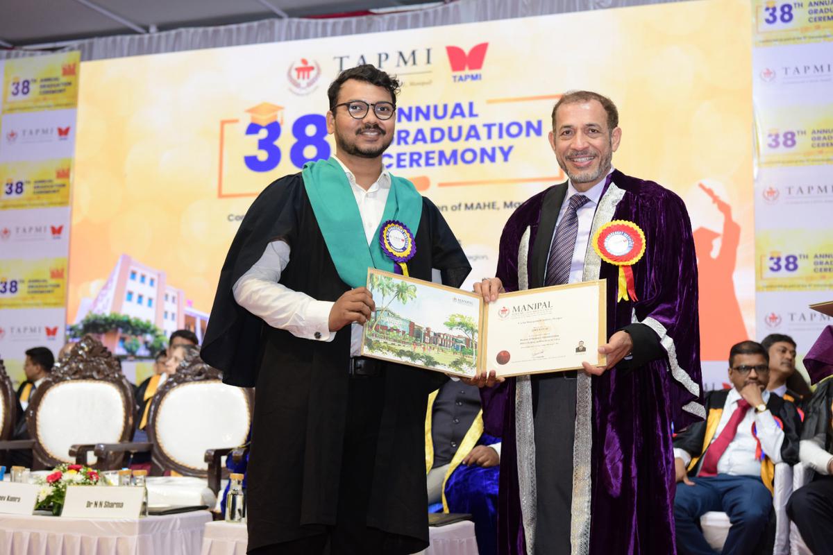Rajeev Kumara, Director, TAMPI handing over a degree certificate to a student at its 38th graduation ceremony in Manipal.