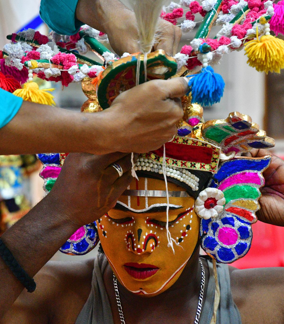 Members of the Purisai Kannappa Thambiran Therukoothu troupe getting ready for a play 