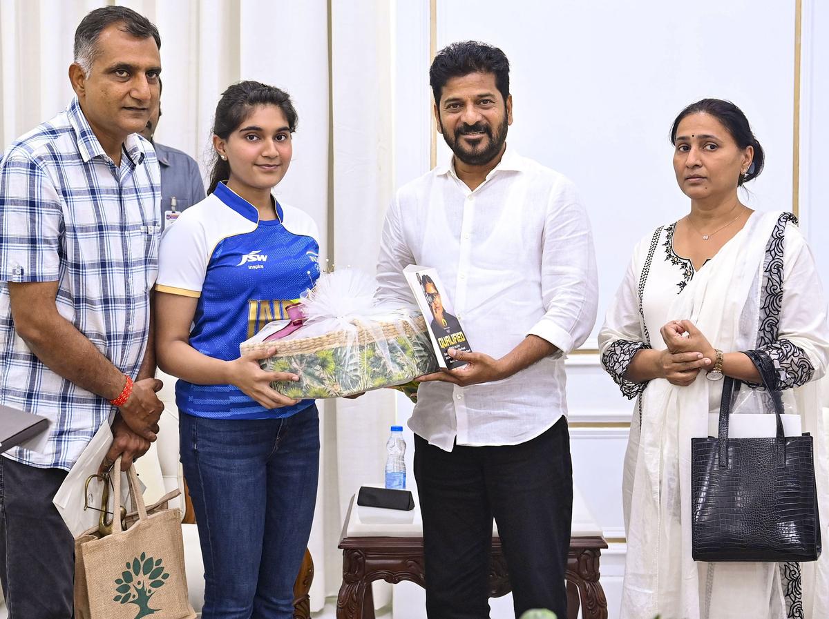 Telangana Chief Minister A Revanth Reddy with Indian amateur shooter Esha Singh. File