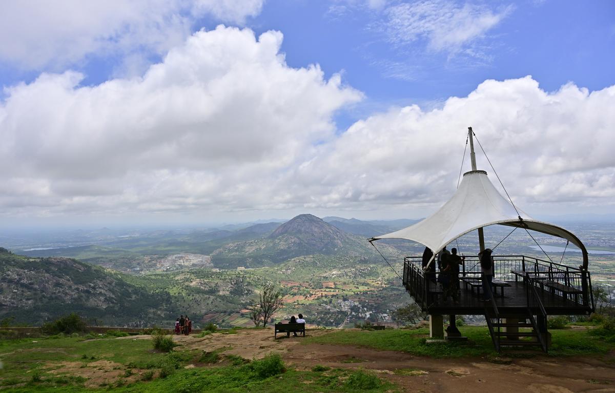 Tourists enjoying the scenic landscapes around Nandi Hills from the top, in Chickballapur district.