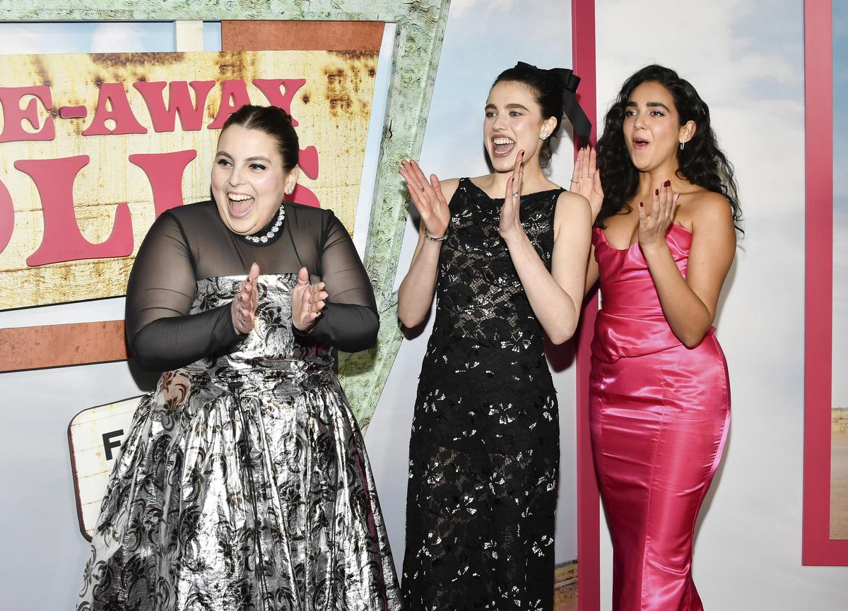 Beanie Feldstein, left, Margaret Qualley and Geraldine Viswanathan attend the premiere of ‘Drive-Away Dolls’
