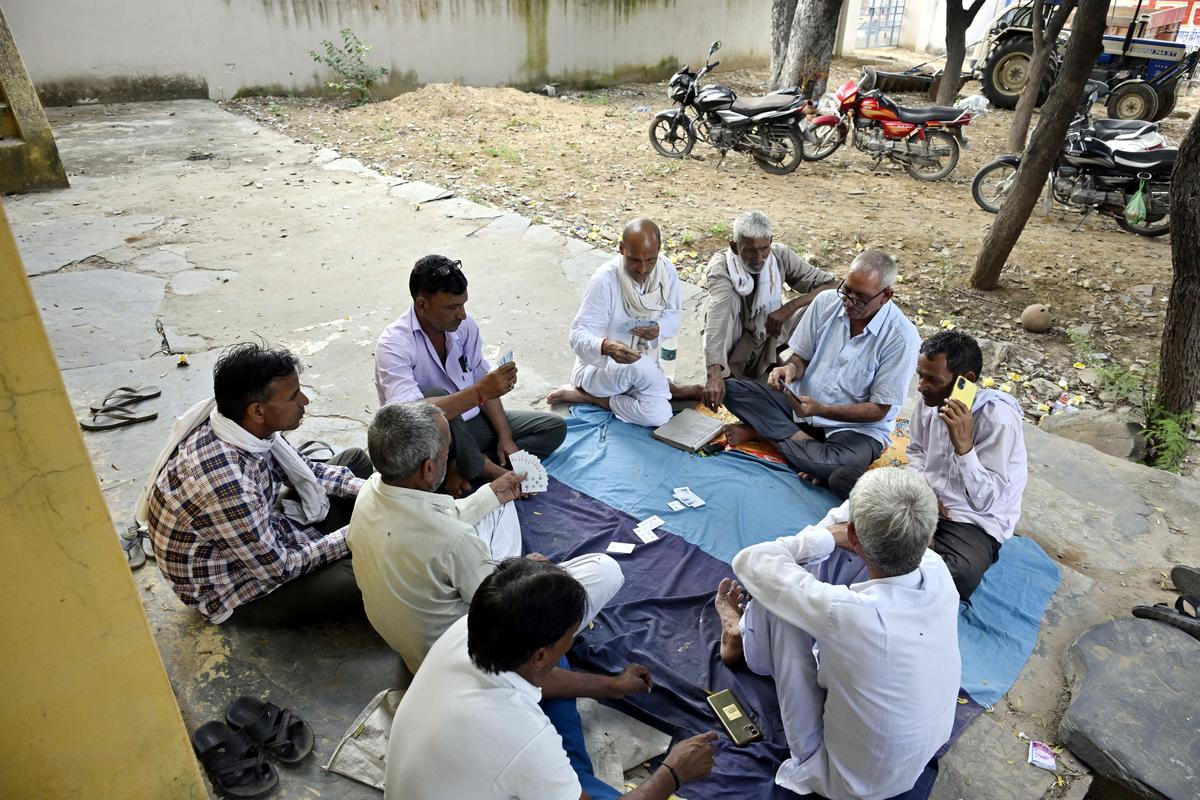 Villagers play cards in the Ateli Vidhan Sabha seat ahead of the assembly polls at Dhanonda in Mahendragarh district of Haryana Villagers play cards in the Ateli Vidhan Sabha seat ahead of the assembly polls at Dhanonda in Mahendragarh district of Haryana