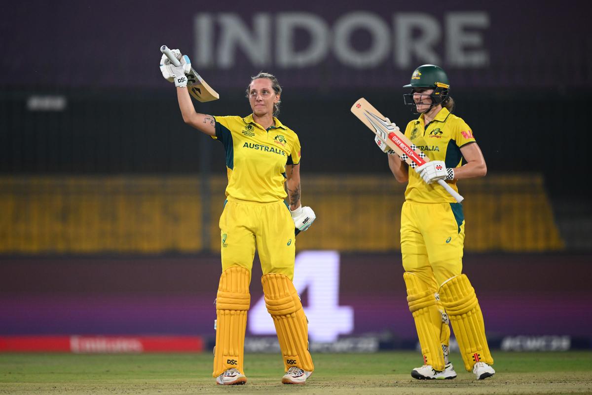 Ashleigh Gardner of Australia celebrates her century alongside Annabel Sutherland during the ICC Women's Cricket World Cup 2025 match between Australia and England at the Holkar Cricket Stadium on October 22, 2025 in Indore, India. Ashleigh Gardner of Australia celebrates her century alongside Annabel Sutherland during the ICC Women's Cricket World Cup 2025 match between Australia and England at the Holkar Cricket Stadium on October 22, 2025 in Indore, India.