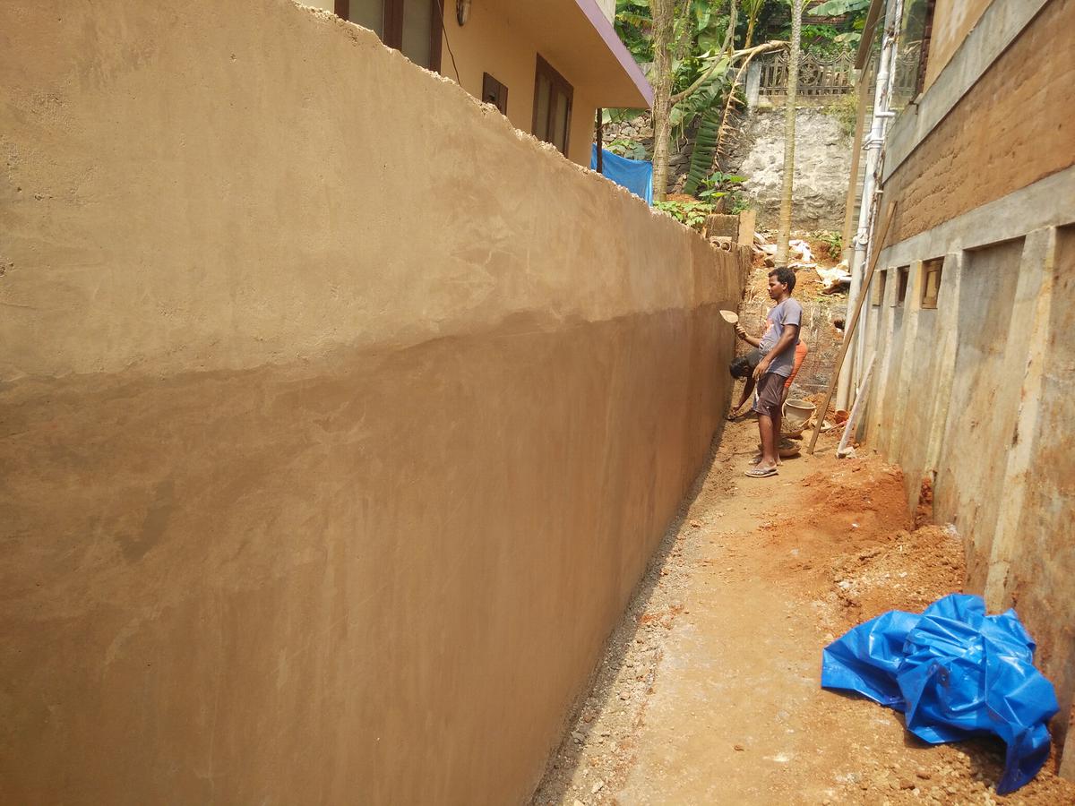 Mud rendering on the debris wall.