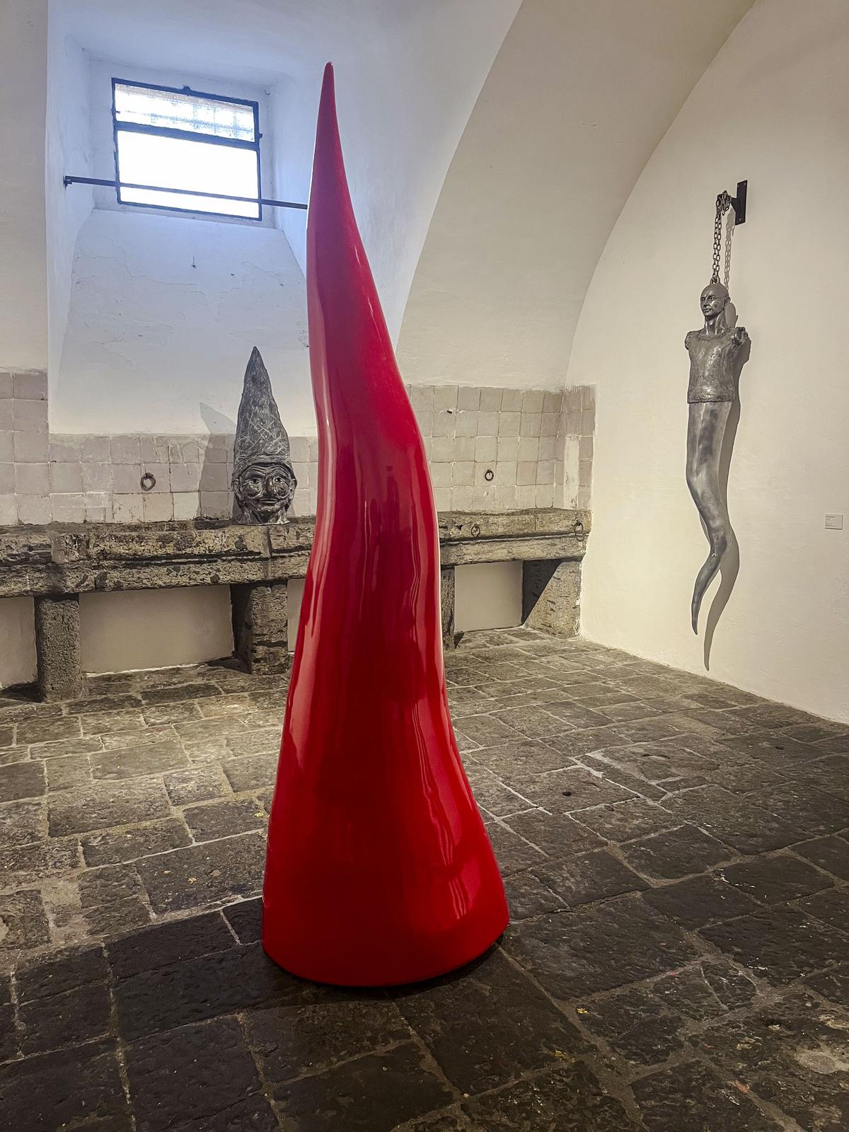 A giant Neapolitan horn, similar to the one he made for the 2024 Bangkok Biennale, is shown inside Italian sculptor Lello Esposito’s art gallery in Naples.