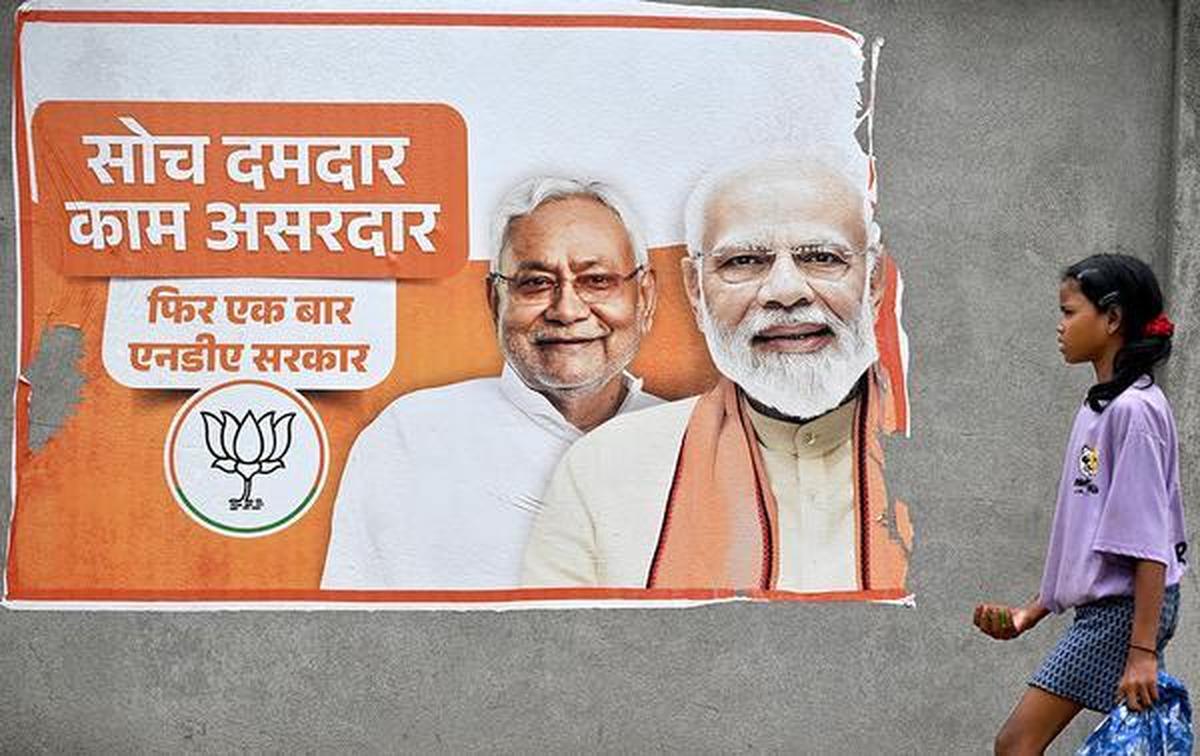 A poster of Bihar's Chief Minister Nitish Kumar and Prime Minister Narendra Modi is seen in Purnia, Bihar A poster of Bihar's Chief Minister Nitish Kumar and Prime Minister Narendra Modi is seen in Purnia, Bihar