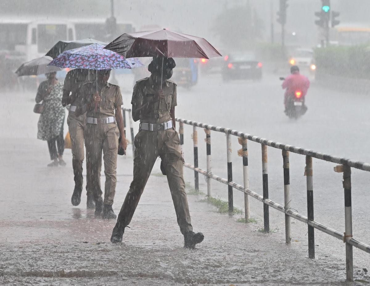 Women police personnel braving heavy rain while on duty at East Fort in Thiruvananthapuram on Tuesday. 
