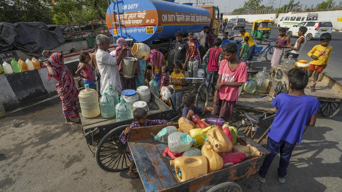 People wait in long queues as Delhi continues to grapple with water shortage