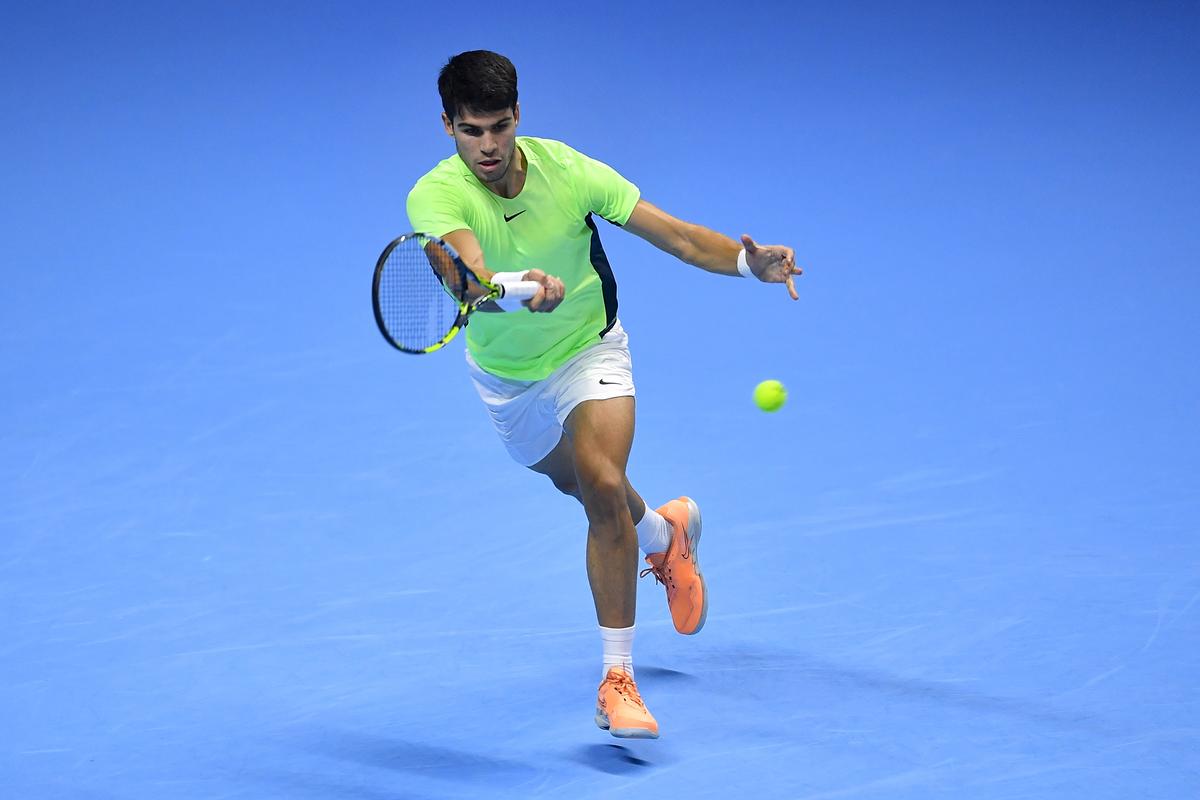 Carlos Alcaraz of Spain plays a forehand against Novak Djokovic of Serbia during the Men’s Singles semifinal match at the Nitto ATP Finals.