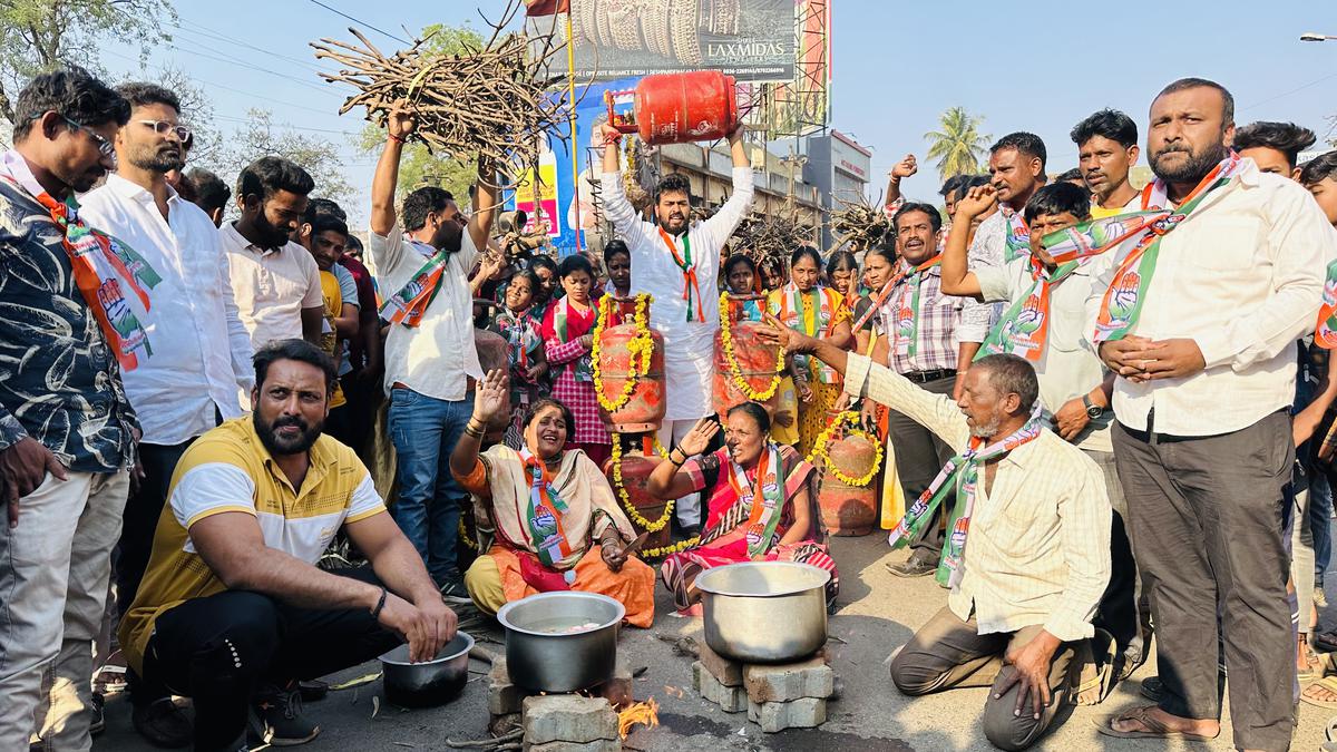 Activists cook on the street using firewood in protest against hike in LPG cylinder price