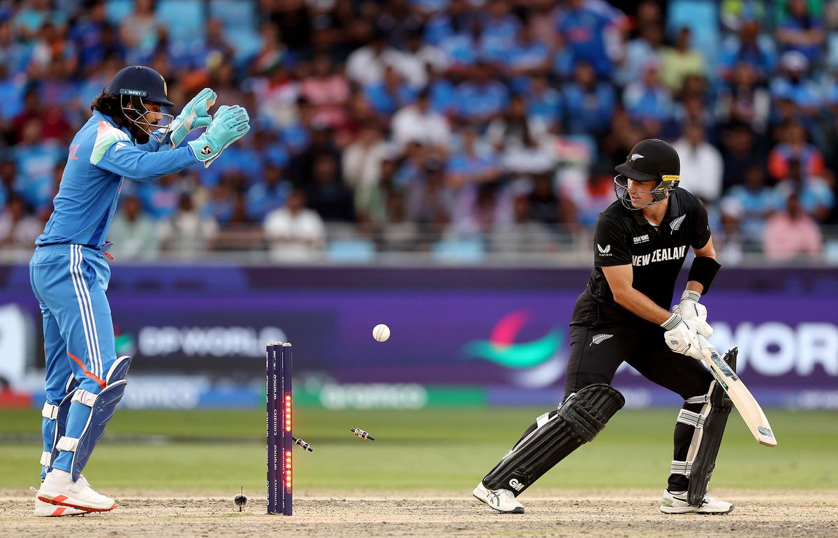 K.L. Rahul of India celebrates as Will Young of New Zealand reacts as he is bowled out by Varun Chakravarthy of India (not pictured) during the ICC Champions Trophy 2025 match between New Zealand and India at Dubai International Cricket Stadium on March 2, 2025 in Dubai, United Arab Emirates. 