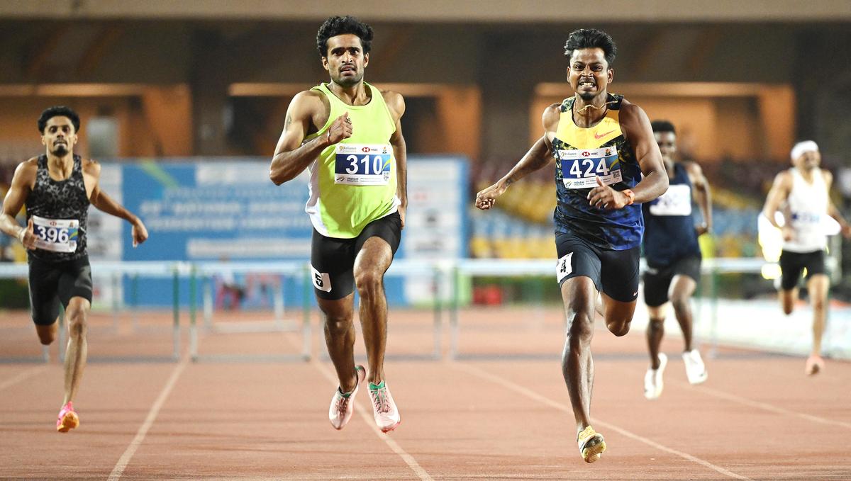 Close win: Yashas, left, pipped Santhosh in a keenly-contested 400m hurdles final.