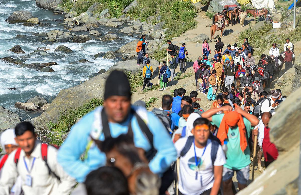 Pilgrims on their way to the Amarnath cave shrine, near Chandanwari base camp, at Pahalgam in Anantnag district. The 43-day yatra began after a gap of over two years due to COVID-19. 